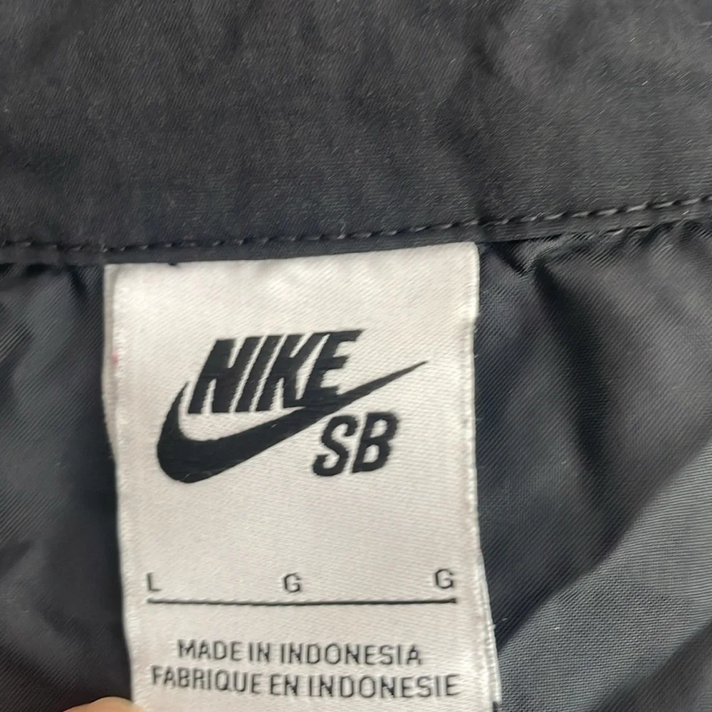 Nike black windbreaker
